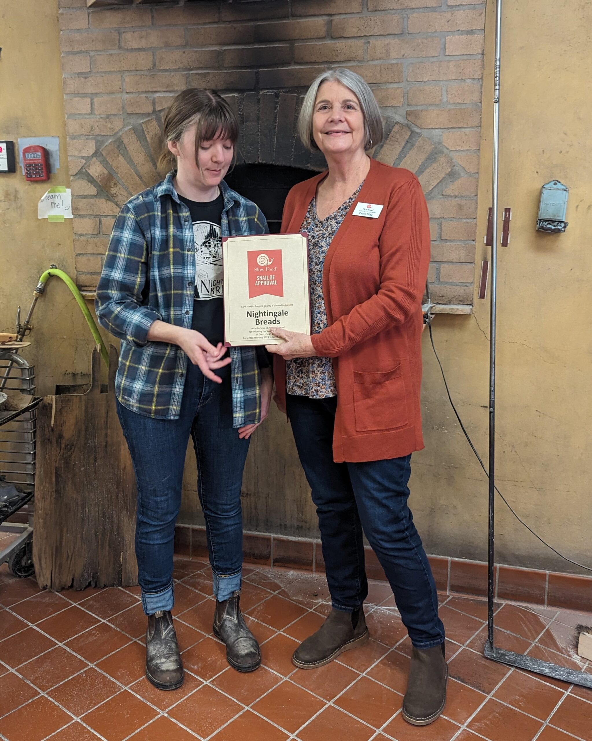 Carol Diaz awarding Nightingale Bread